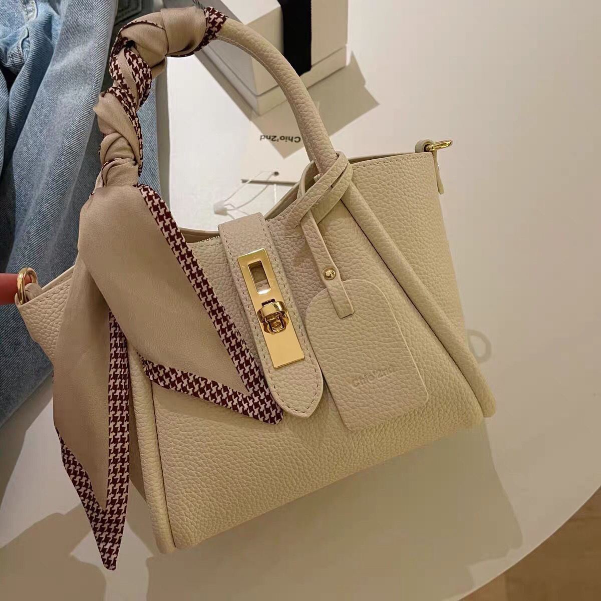 Elegant Ivory Litchi-Pattern Handbag with Gold Lock & Silk Scarf Strap